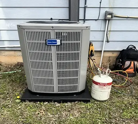 Performing preventive maintenance tune up on a customer's unit.