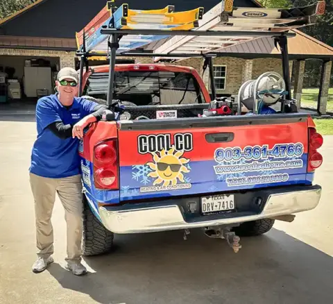 The owner of Cool Co Heating & Air Conditioning, Shane Stone, with his service truck.